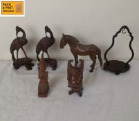 A pair of carved Chinese hardwood storks along with other carved items. H.15cm. (Tallest).