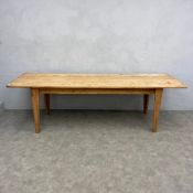 A large 20th century pine farmhouse refectory style dining table with rectangular plank top raised