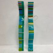 A pair of hand blown coloured art glass applique wall sculptures of wavey square form by Gunta