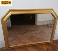 A contemporary wall or overmantel mirror in arched gilt frame. 91x68cm.