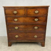 A Georgian mahogany chest of two short over three long cockbeaded drawers raised on shaped bracket