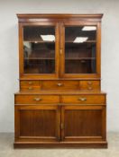 A 19th century mahogany two section library bookcase, the glazed upper section above base fitted