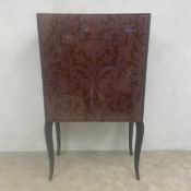 A contemporary Knowles & Christou drinks or TV cabinet with glazed damask patterned doors raised