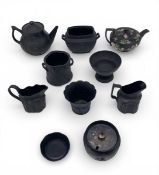 A mixed collection of possibly 18th century and later Wedgwood and other black basalt ceramics to