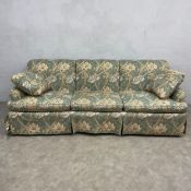 A contemporary Howard style three seater sofa in William Morris Windrush upholstery by Baker