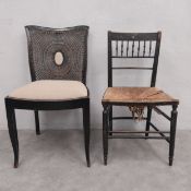 An ebonised Arts & Crafts Sussex chair with rush seat in the style of William Morris together with a