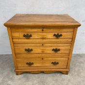 A C.1900 satinwood chest of three long drawers raised on shaped bracket supports. H.82 W.84 D.51cm.