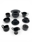 A mixed collection of possibly 18th century and later Wedgwood and other black basalt ceramics to
