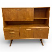 A 1960s teak side cabinet designed by Frank Guille for Austinsuite. H.136 W.153 D.47cm.