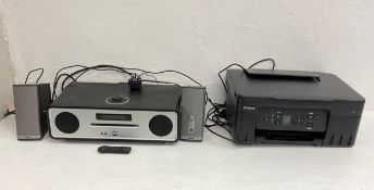 A modern Ruark Audio R4 Mk3 Integrated Music System together with a pair of Bose speakers and a