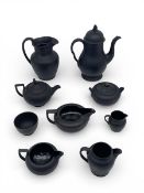 A mixed collection of possibly 18th century and later Wedgwood and other black basalt ceramics to