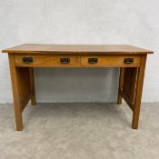 A 20th century L & J G Stickley oak writing table in the Arts and Crafts style with stamp and
