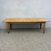 A large 20th century pine farmhouse refectory style dining table with rectangular plank top raised