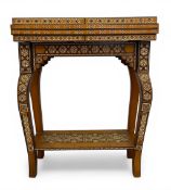 A late 20th century Syrian Damascus inlaid games table with hinged swivel top enclosing backgammon