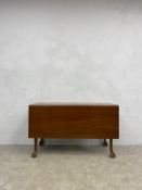 A 19th century mahogany side or dining table with single drop flap on cabriole ball and claw