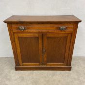 A C.1900 oak sideboard or dresser base with frieze drawers over two panel doors enclosing two
