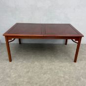 A lacquered Chinese teak extending dining table with extra leaf. H.76 W.183 D.111cm. (Extended