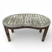 A weathered teak garden low table with slatted top and maker's label. H.58 W.109 D.62cm.