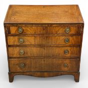 A Georgian flame mahogany bureau with fitted interior above four long graduating drawers on shaped