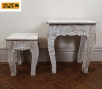 Two carved, painted and distressed Eastern stools. H.45 (Largest).