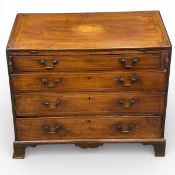 A Georgian mahogany bureau with satinwood conch shell inlaid fall front enclosing fitted interior