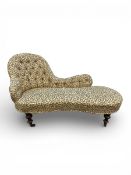 A 19th century deep buttoned chair-end chaise in foliate upholstery on turned supports. H.82 W.153