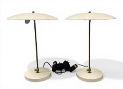 A pair of mid-century German table lamps with white powder coated aluminium shades over the