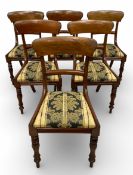 A set of six Regency mahogany bar-back dining chairs with drop in seats raised on turned supports.