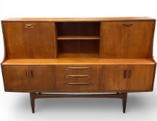 A mid century teak G-Plan Fresco side cabinet. H122 W.188 D.46cm.