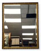 A large contemporary gilt mirror with bevelled plate. H.142 W.112cm