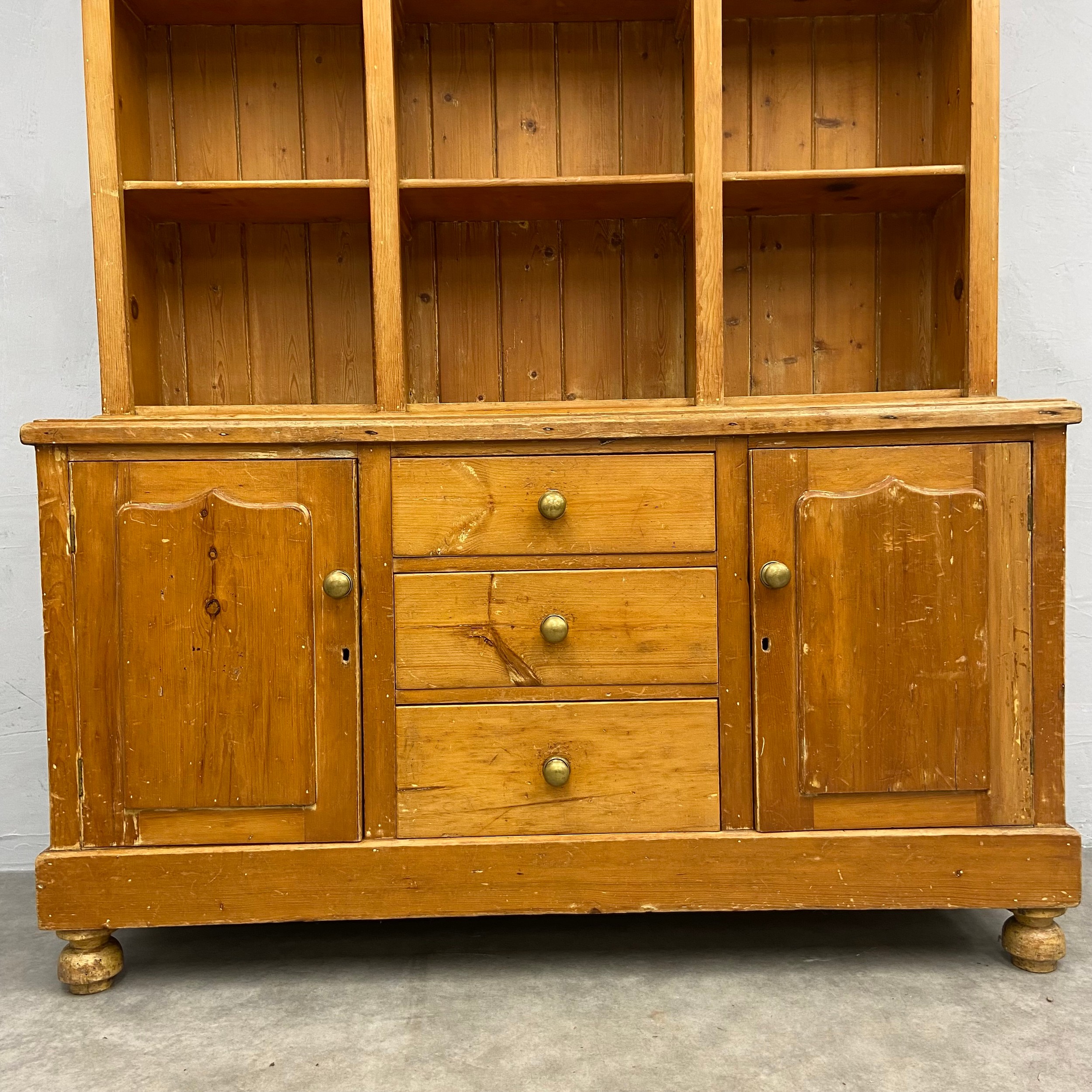 A C.1900 pine dresser in two parts with three shelves over base cabinets and drawers raised on bun - Image 4 of 5