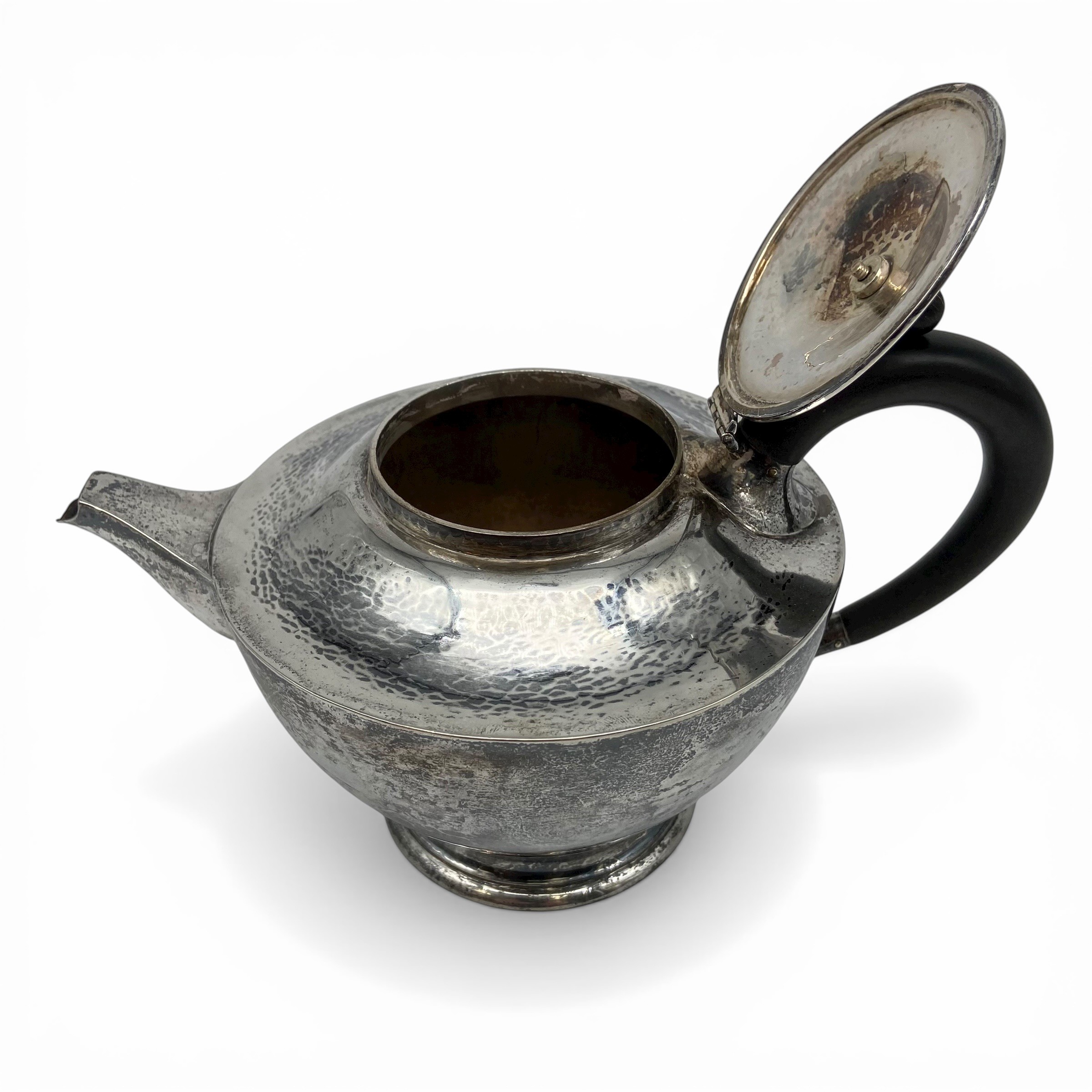 An Arts & Crafts hammered sterling silver teapot by Birmingham Guild of Handicraft Ltd, 1901 with - Image 2 of 3