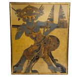 A large 1970s Indonesian batik fabric painting depicting a deity or figure from folklore. Signed and