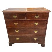 A Georgian oak chest of two short over three long cockbeaded drawers raised on bracket supports. H.