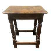 A C.1800 oak joint stool with thumb-moulded top over the carved frieze raised on turned and