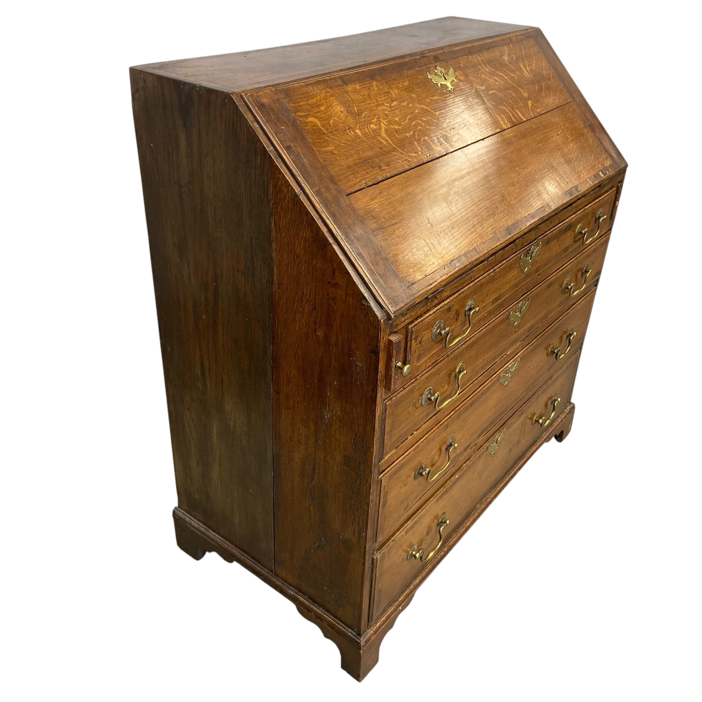 A Georgian oak bureau with fall front enclosing fitted interior over four long graduating drawers - Image 5 of 6