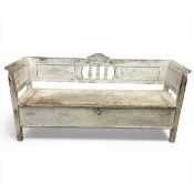 A C.1900 white painted and distressed Gustavian style Scandinavian bench or settle with shaped