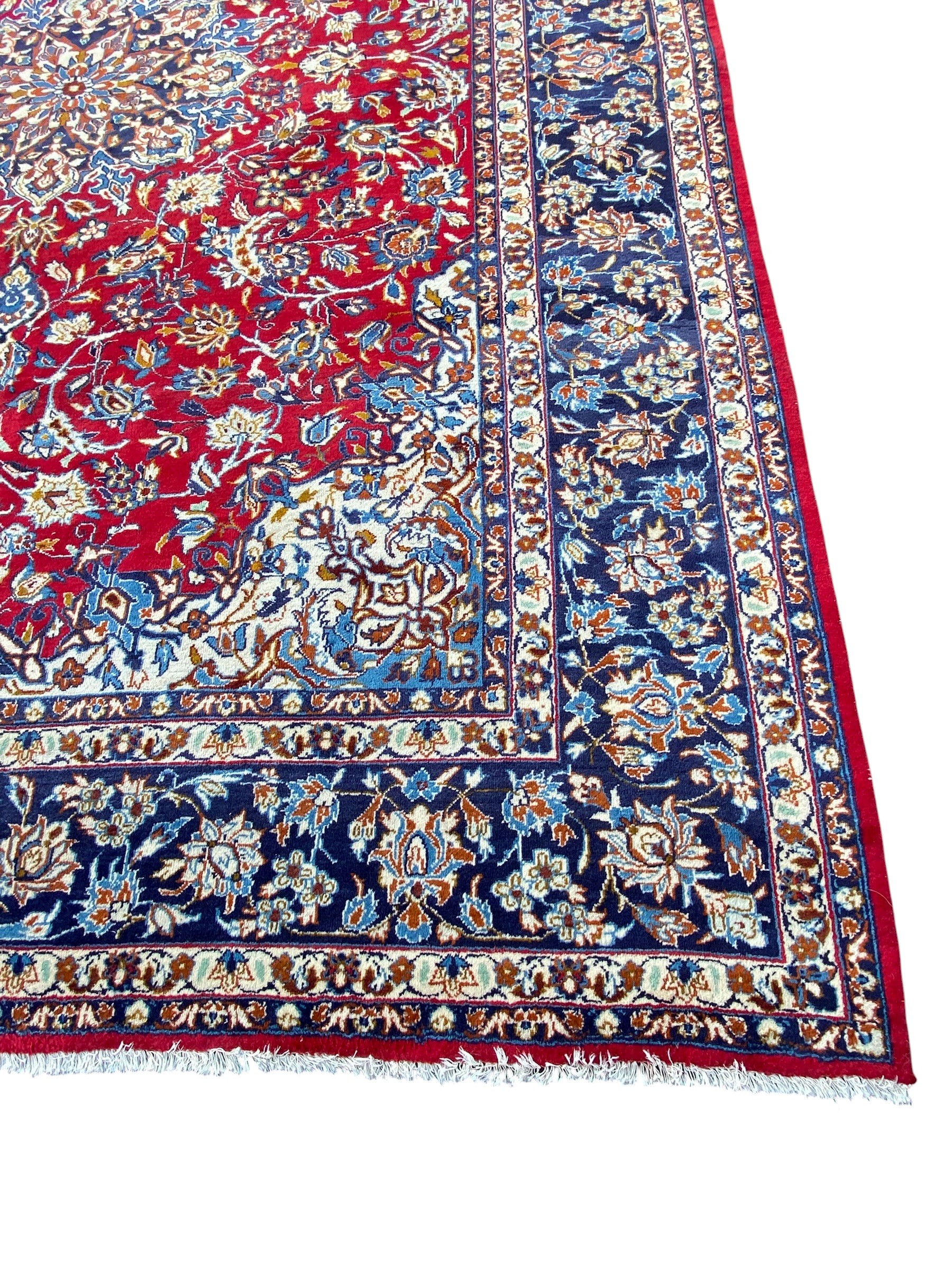 A large Persian Najafabad carpet with central flowerhead medallion in the polychrome field over a - Image 2 of 4