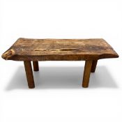 A vintage rustic live edge yewwood bench or coffee table raised on straight circular section