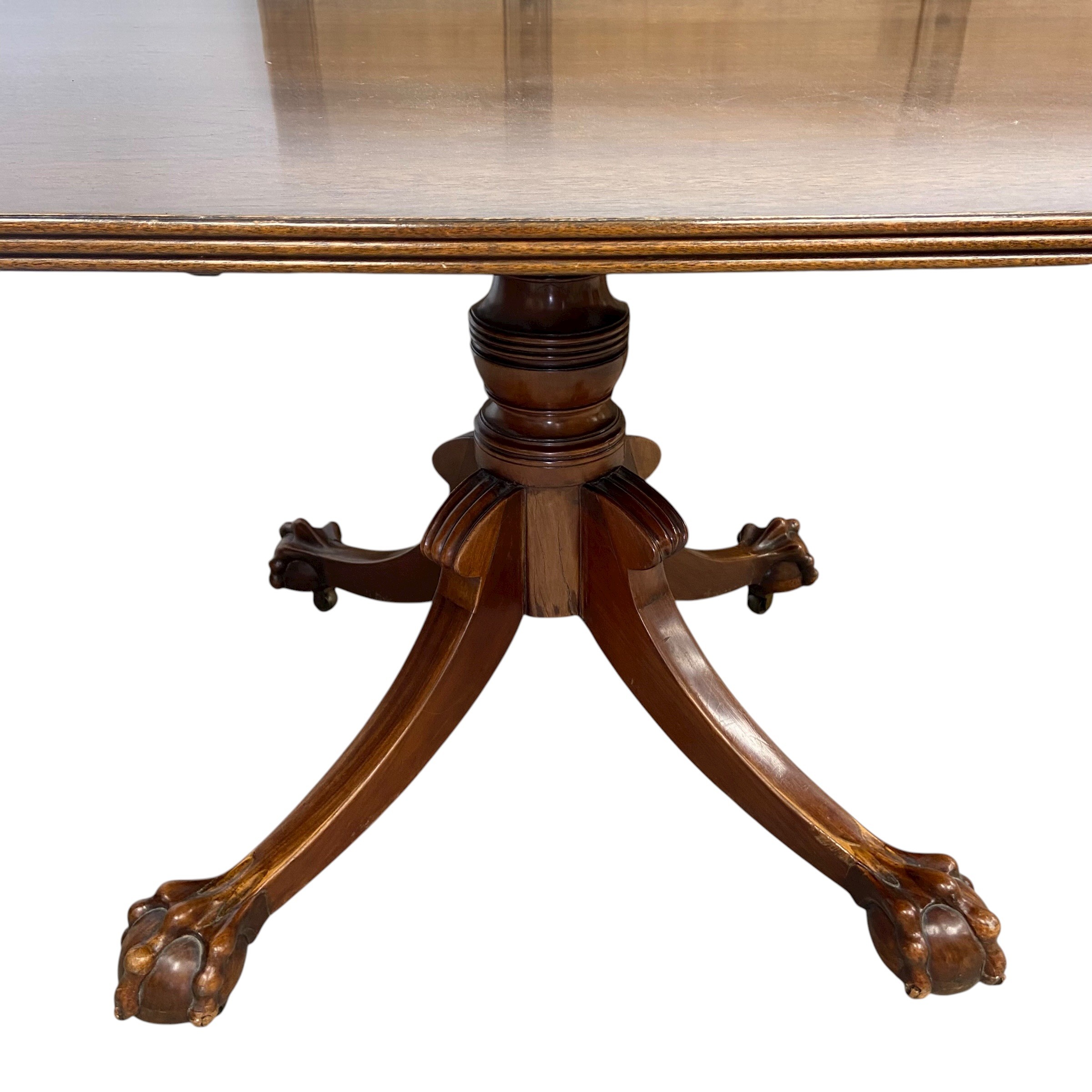 A 19th century mahogany dining table with shaped top over the turned pedestal raised on splayed - Image 3 of 5