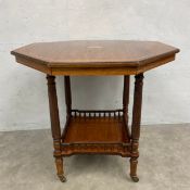 A late 19th century rosewood occasional table with satinwood inlay on ring turned supports united by