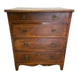 A 19th century mahogany chest of four long satinwood inlaid drawers over the shaped apron raised
