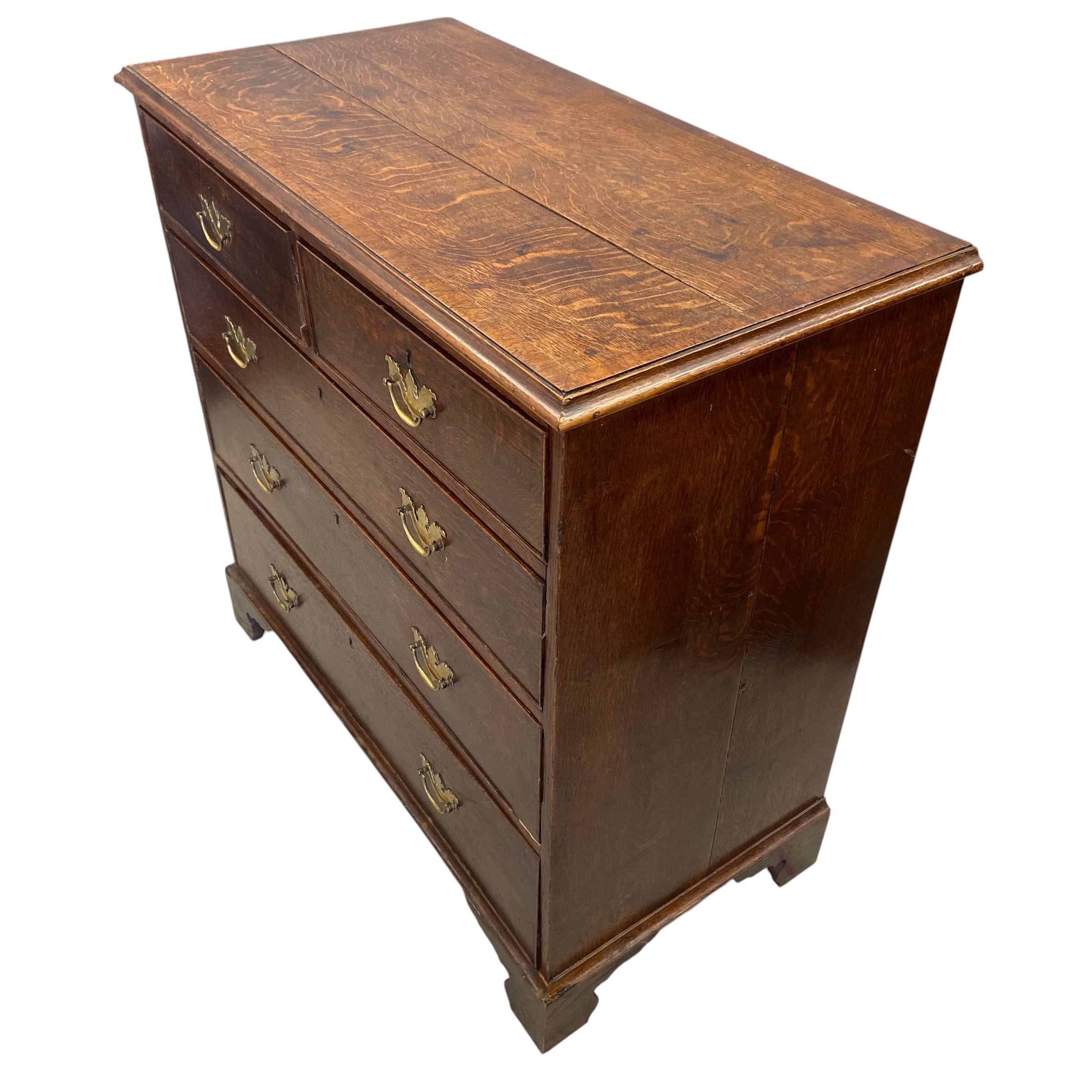 A Georgian oak chest of two short over three long cockbeaded drawers raised on bracket supports. H. - Image 3 of 4