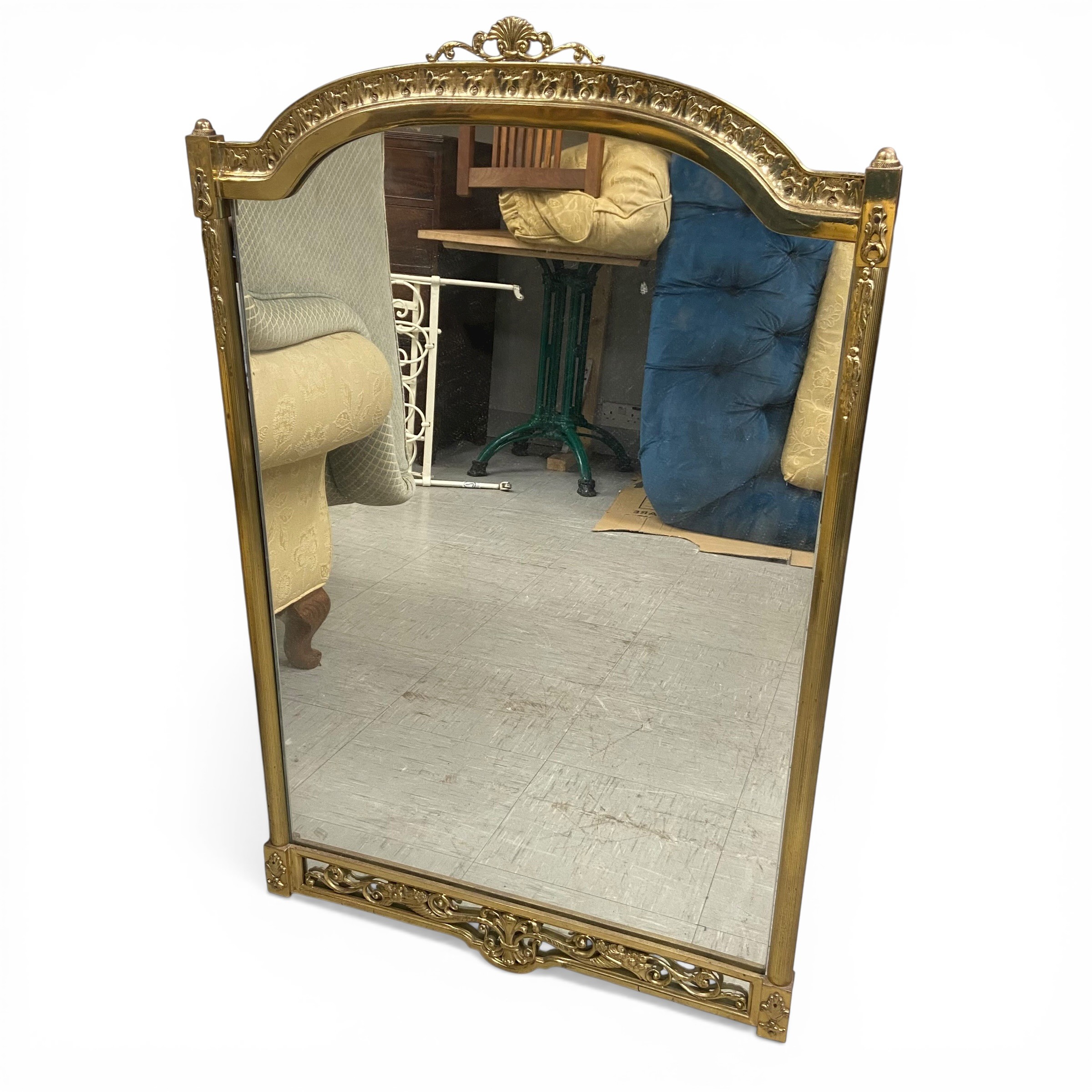 A vintage wall mirror with shaped plate in a 19th century style brass frame. 98x62cm.