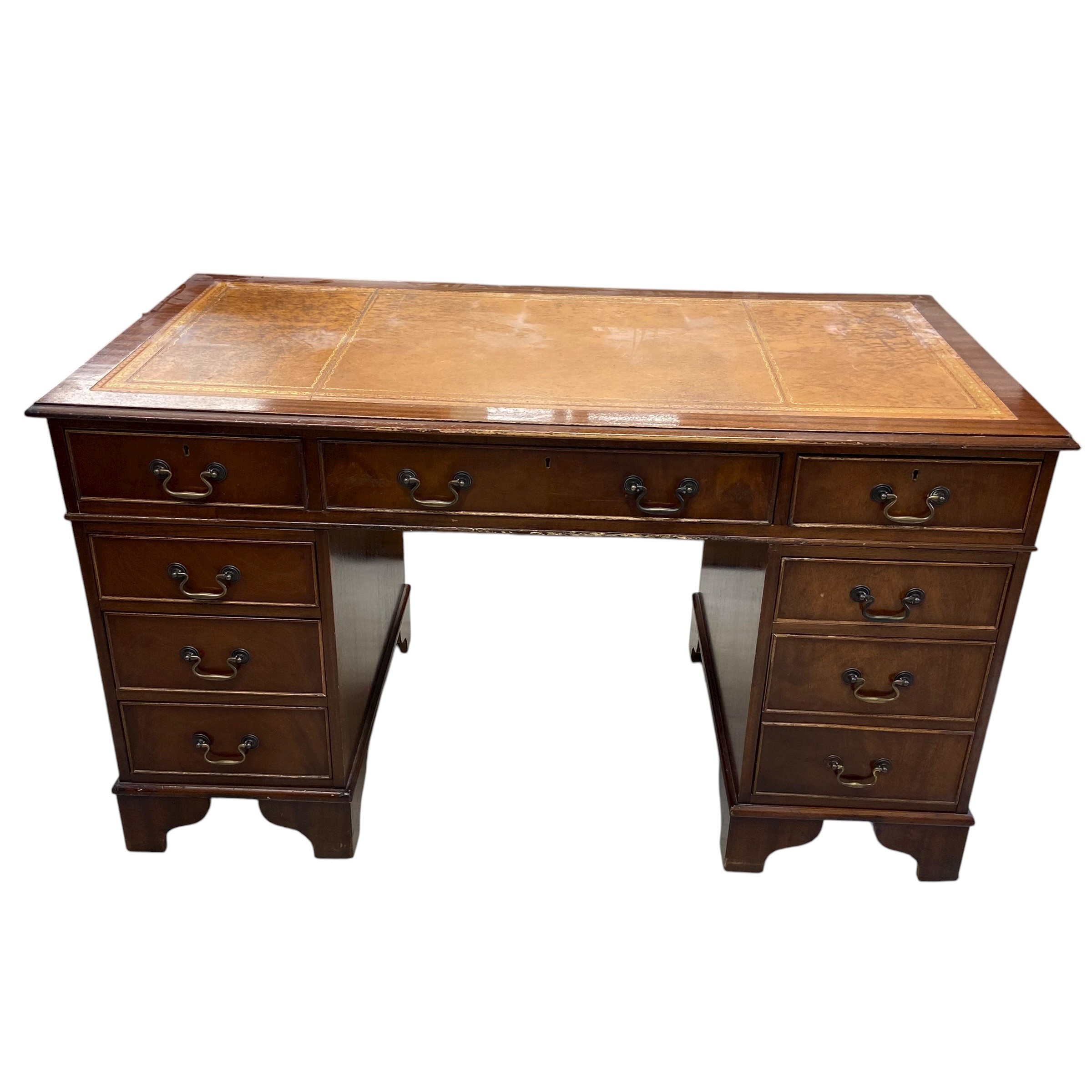 An mid 20th century Georgian style mahogany twin pedestal desk with gilt and tooled tan leather