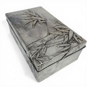 An early 20th century Japanese hammered sterling silver cigarette box with bamboo decoration and