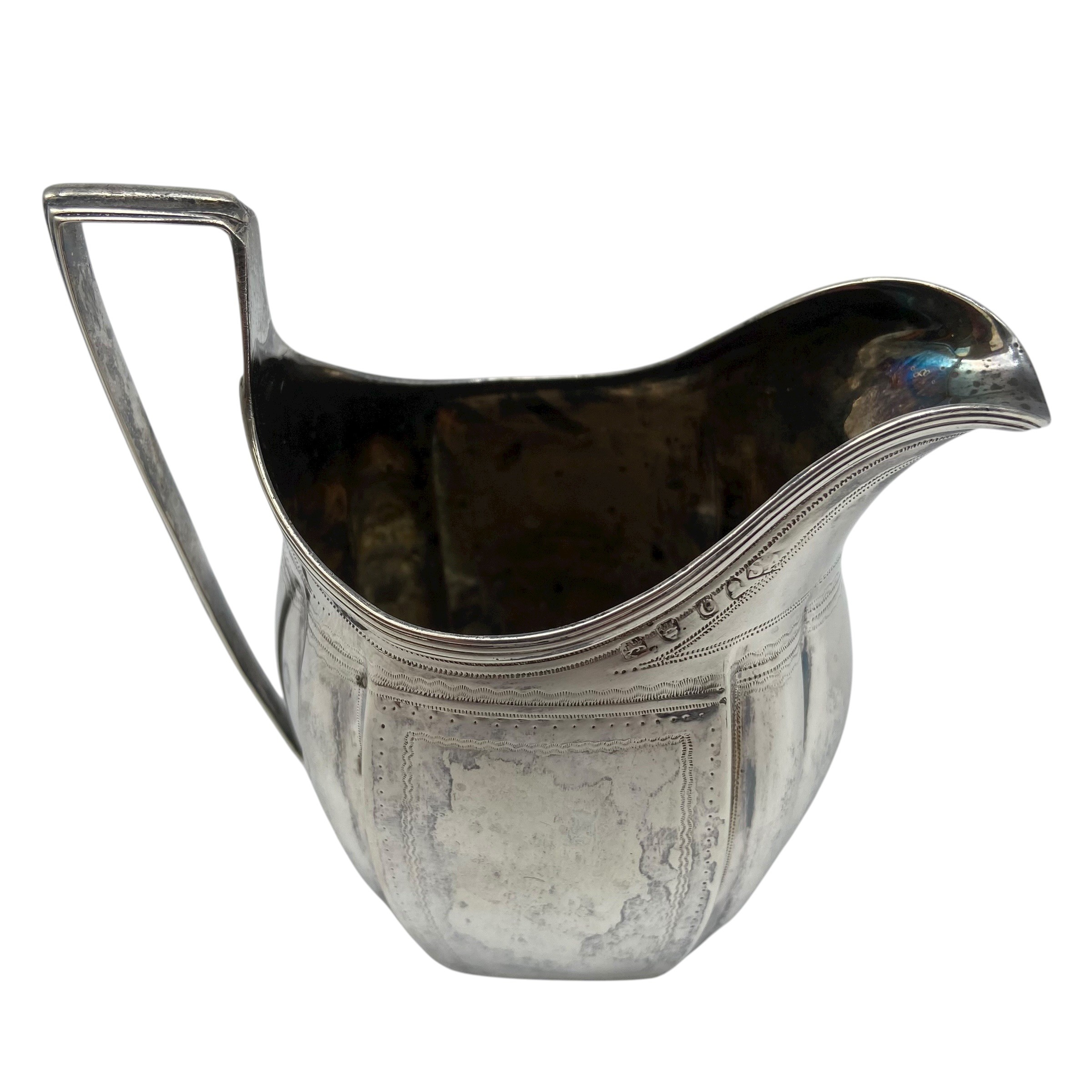 An Arts & Crafts hammered sterling silver creamer by Birmingham Guild of Handicraft Ltd, 1903 - Image 9 of 10