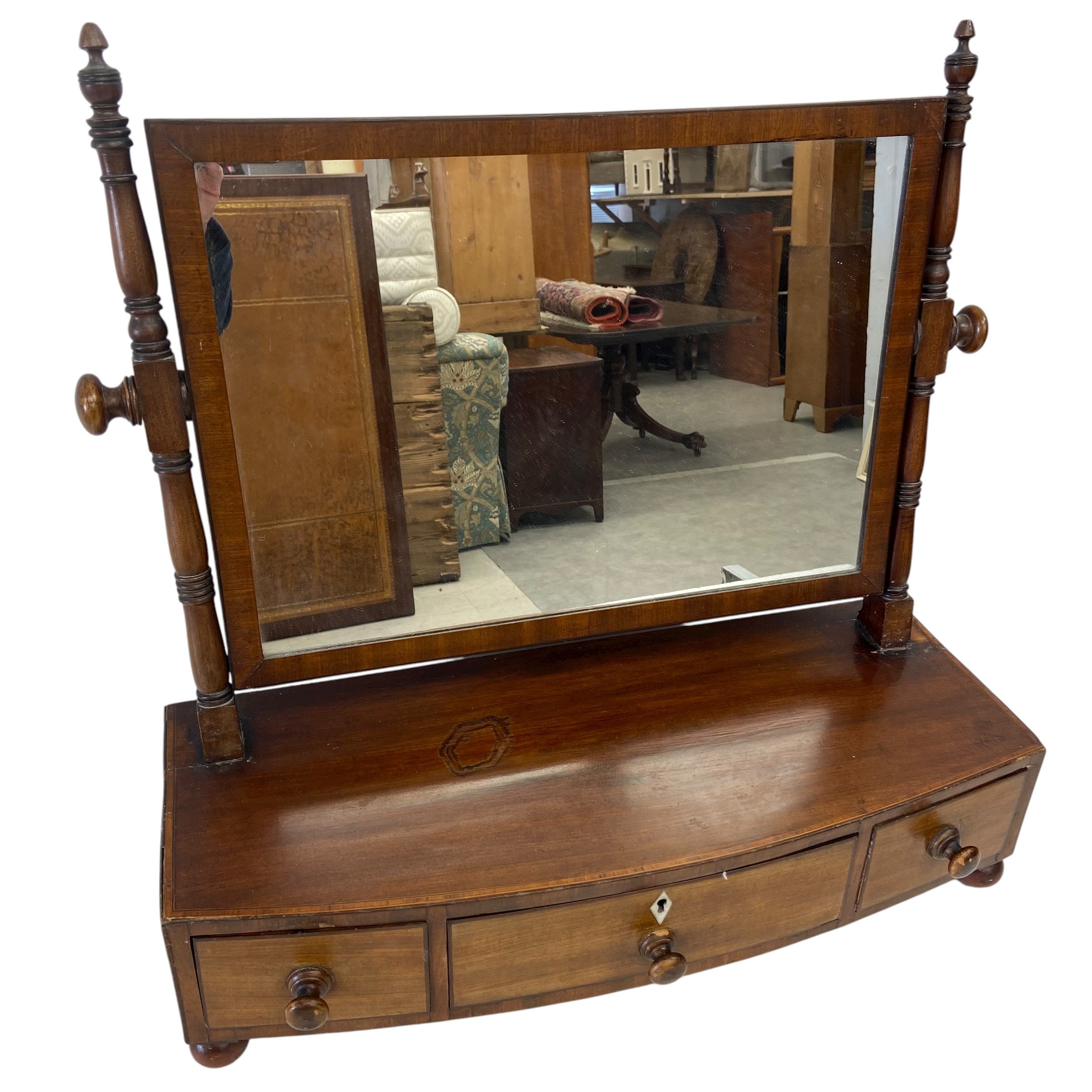 A 19th century mahogany toilet swing mirror with square plate in a crossbanded frame over three