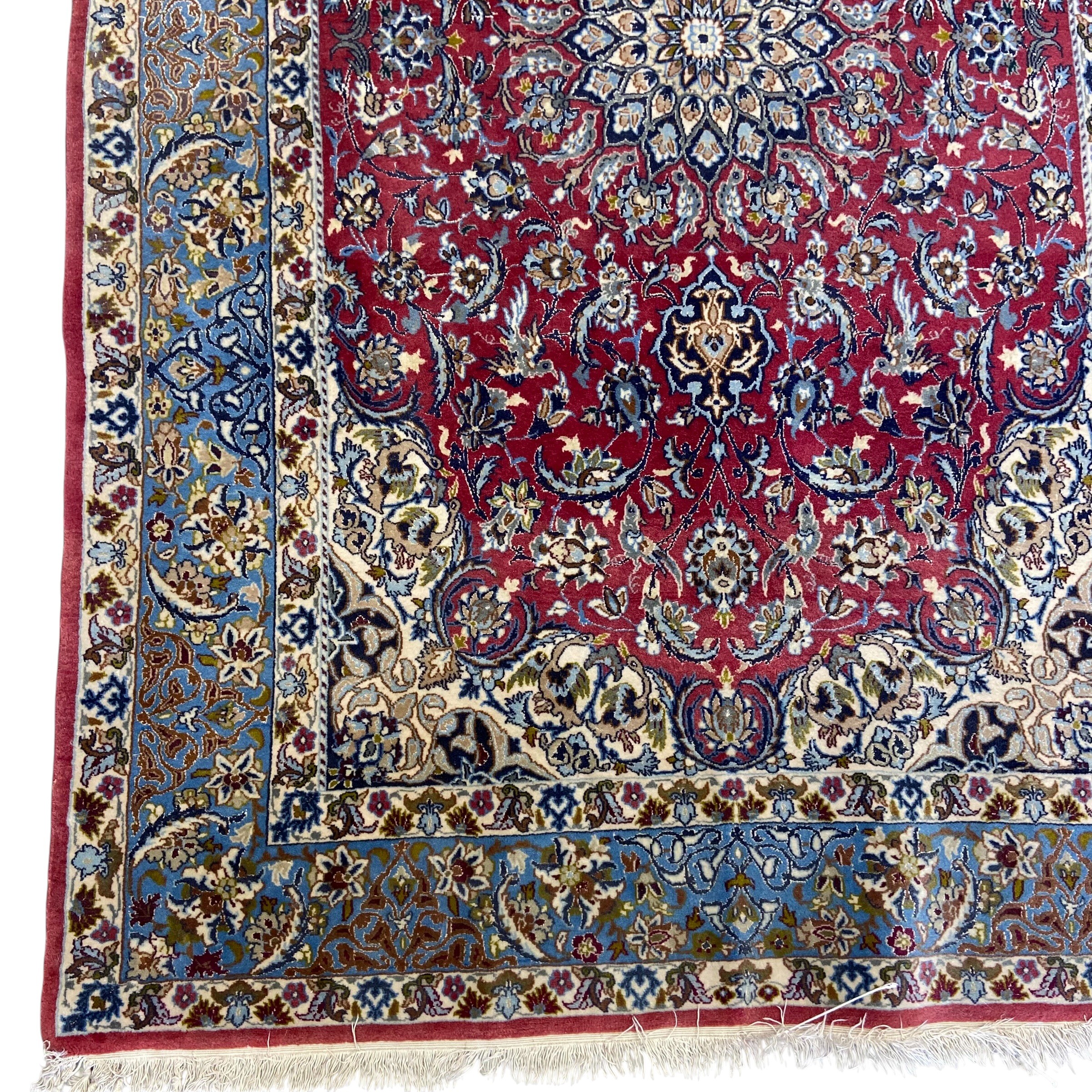A Persian Najafabad rug with central flowerhead medallion in the polychrome field over a burgundy - Image 2 of 3