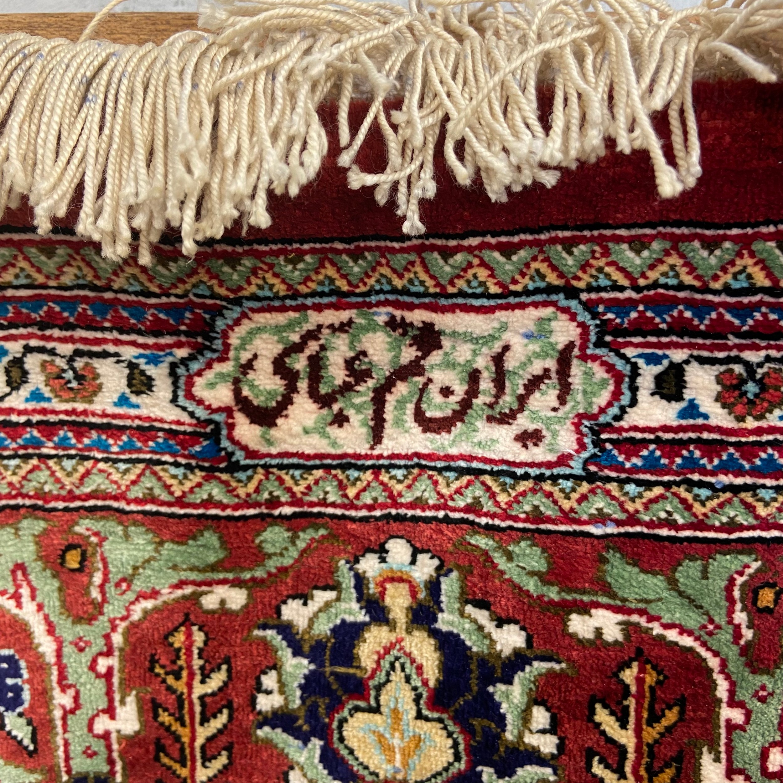A signed Persian silk Qum rug with central lozenge medallion in a scrolling field over the - Image 2 of 5